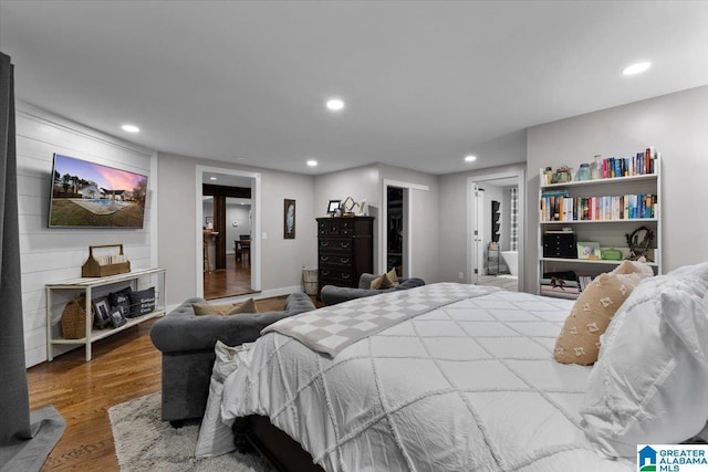 bedroom with hardwood / wood-style floors