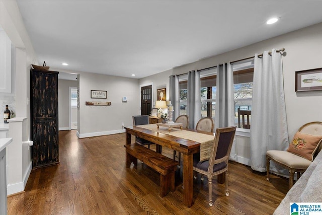 dining room with dark hardwood / wood-style flooring