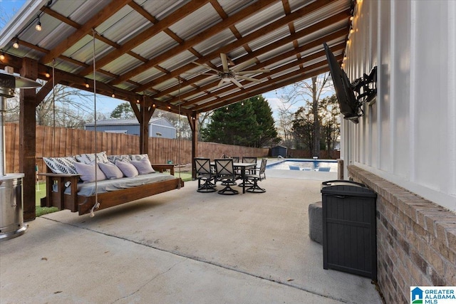 view of patio featuring ceiling fan, a fenced in pool, and outdoor lounge area