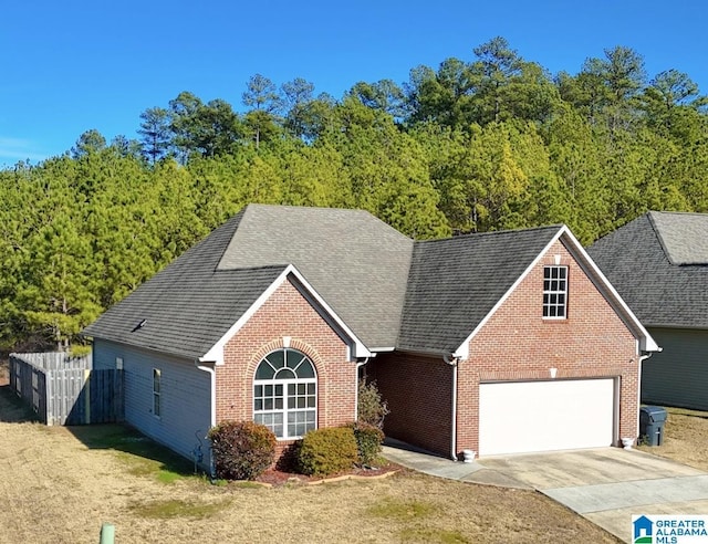 view of front property featuring a garage and a front lawn