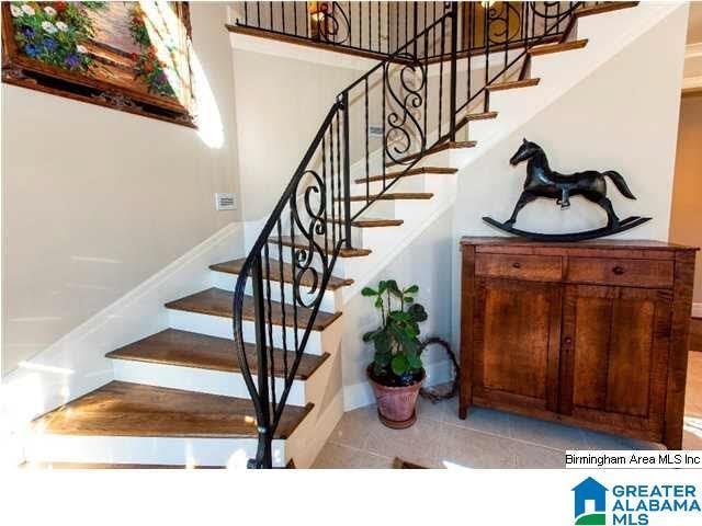 stairs featuring tile patterned floors