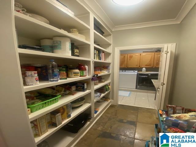 pantry featuring washer and dryer