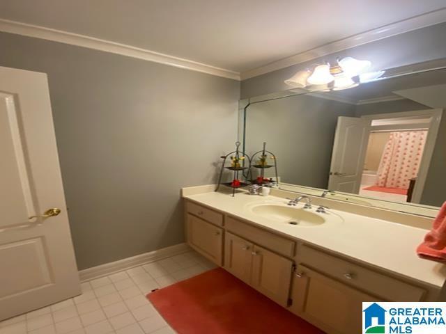 bathroom featuring vanity and ornamental molding