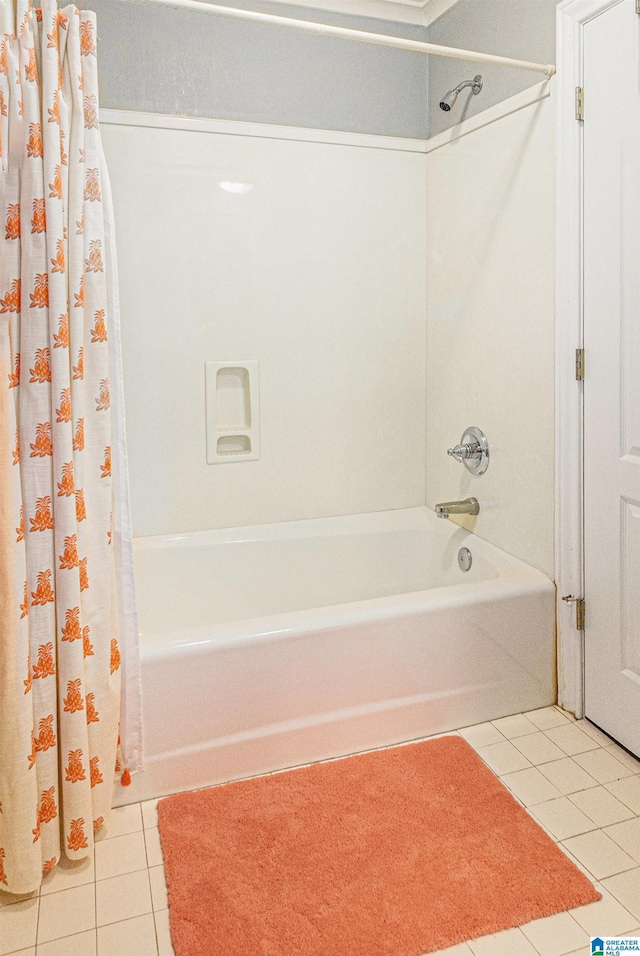 bathroom featuring shower / bathtub combination with curtain and tile patterned floors