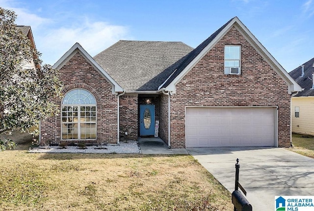 view of property with a garage and a front yard