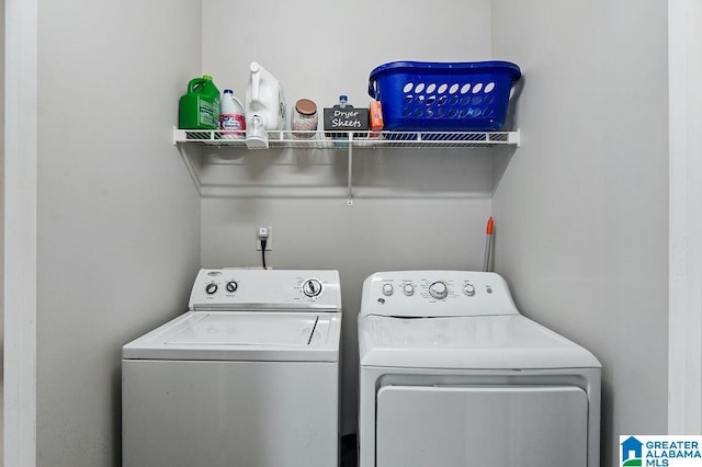 clothes washing area featuring independent washer and dryer