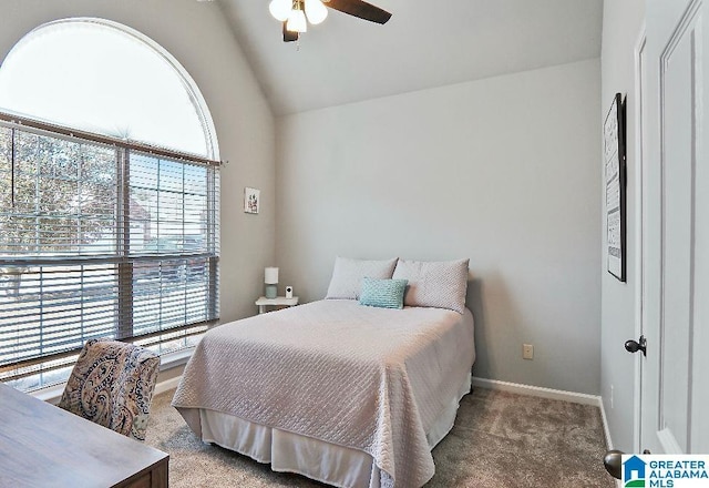 carpeted bedroom with lofted ceiling and ceiling fan