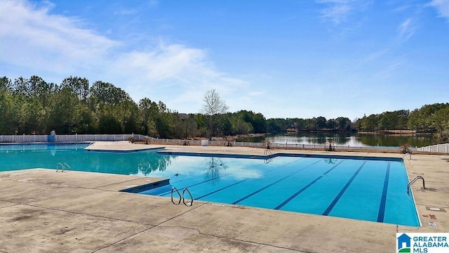 view of pool with a water view