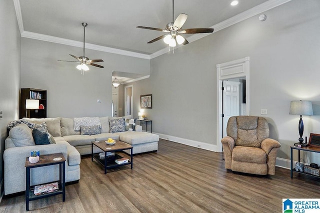 living room featuring wood-type flooring, ornamental molding, and ceiling fan