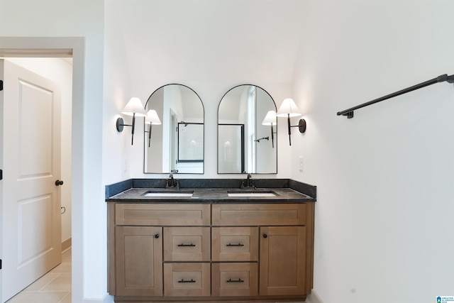 bathroom with tile patterned floors and vanity