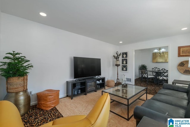 living room with an inviting chandelier