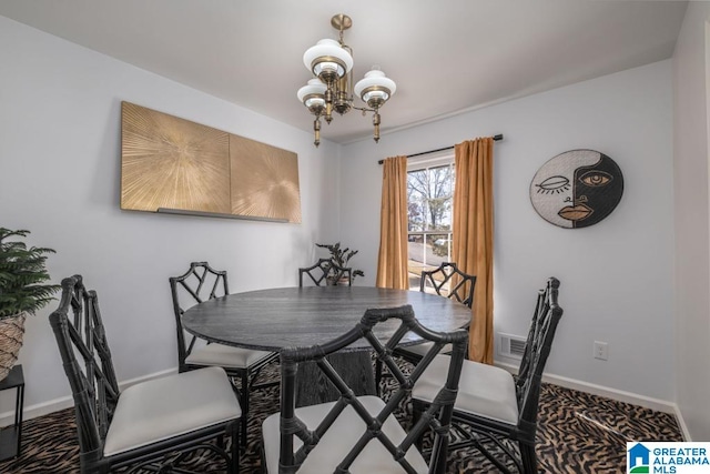 dining area featuring a notable chandelier