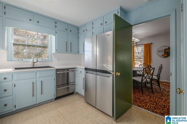 kitchen with sink and stainless steel refrigerator