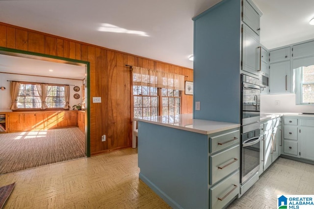 kitchen with wood walls