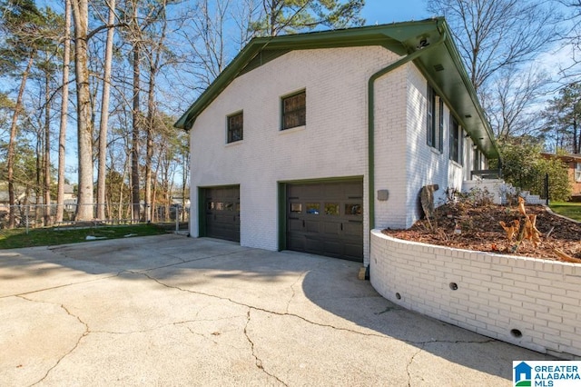 view of side of property with a garage