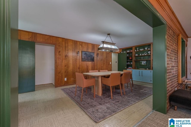 dining room with crown molding and built in features