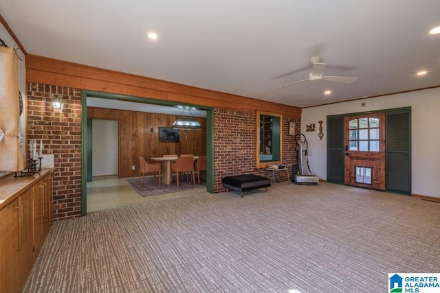 interior space with ceiling fan