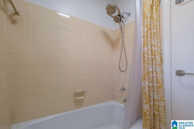 bathroom featuring shower / tub combo with curtain