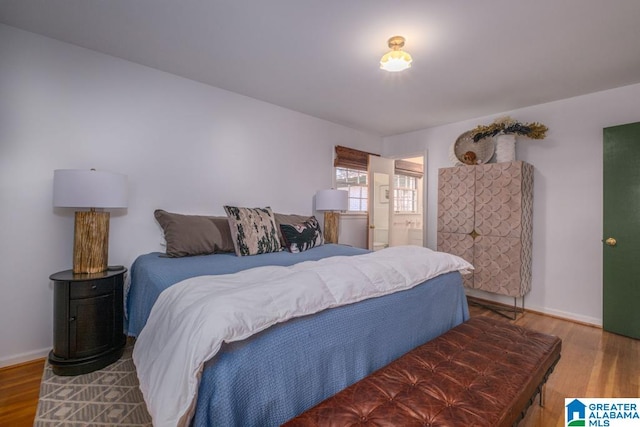 bedroom with wood-type flooring