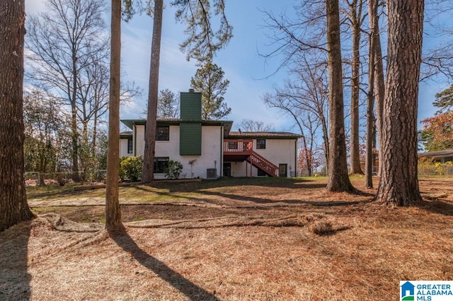 back of property featuring central AC unit