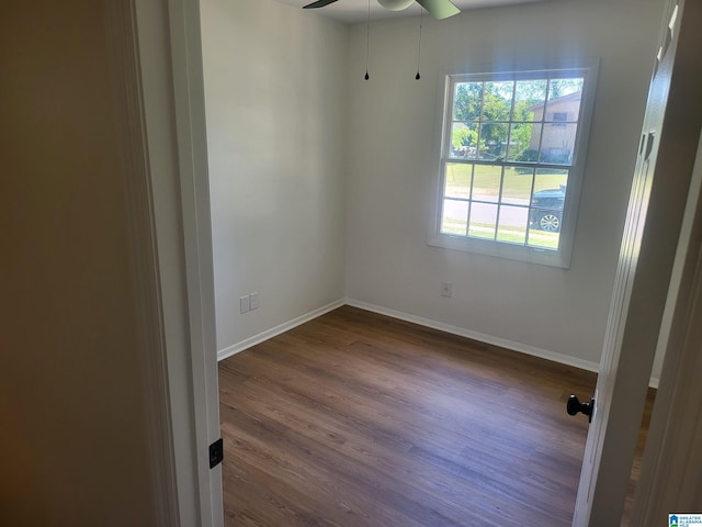 empty room featuring ceiling fan and hardwood / wood-style floors