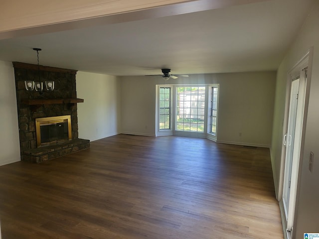 unfurnished living room featuring ceiling fan, hardwood / wood-style floors, and a fireplace