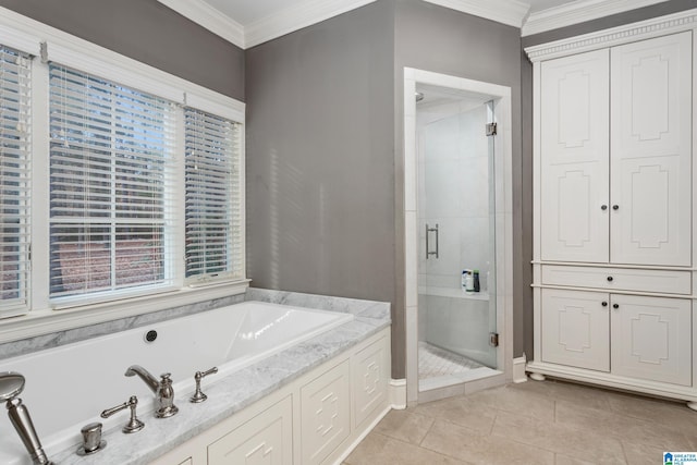 bathroom with ornamental molding, tile patterned flooring, and shower with separate bathtub