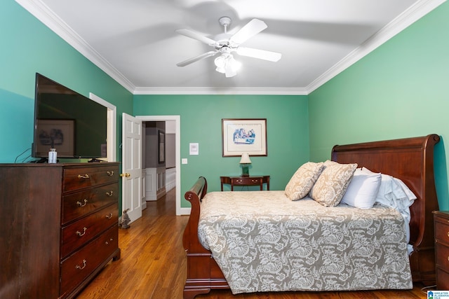 bedroom featuring ornamental molding, ceiling fan, and wood-type flooring