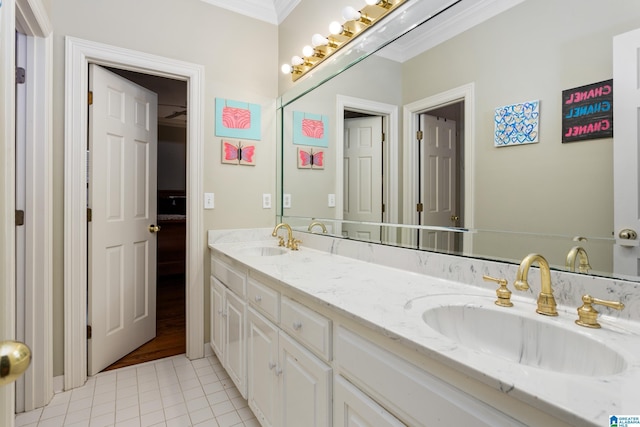 bathroom featuring tile patterned flooring, crown molding, and vanity