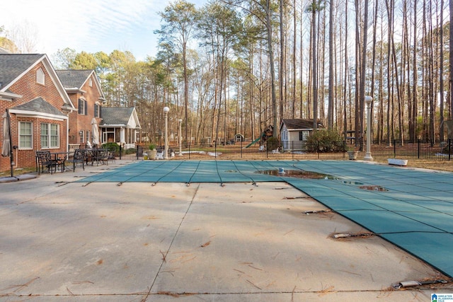 view of swimming pool featuring a patio area