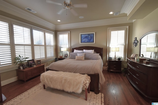 bedroom featuring ceiling fan, crown molding, and dark hardwood / wood-style floors