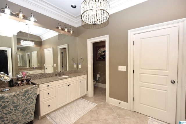 bathroom featuring toilet, a chandelier, tile patterned flooring, ornamental molding, and vanity