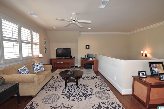 living room with hardwood / wood-style floors, ceiling fan, and crown molding