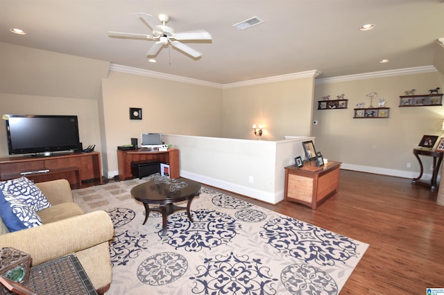 living room with ornamental molding, ceiling fan, and dark hardwood / wood-style floors