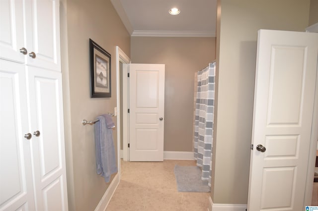 bathroom with crown molding and walk in shower