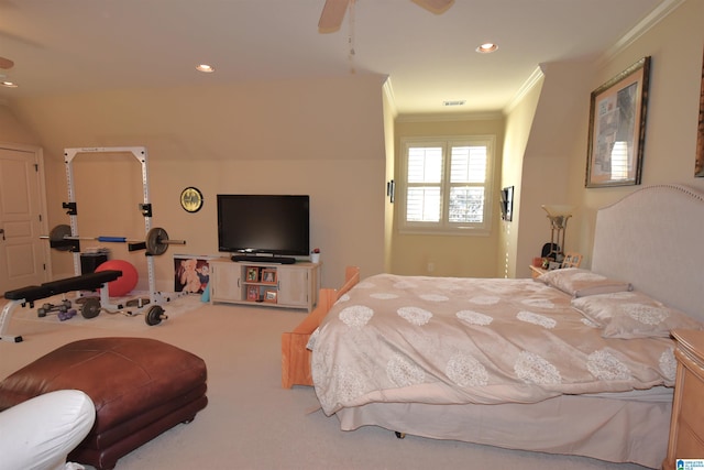 bedroom with ceiling fan, ornamental molding, and carpet