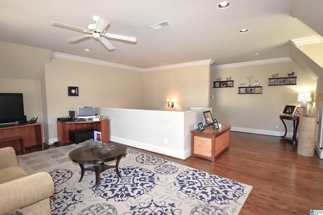 living room with ceiling fan, ornamental molding, and dark hardwood / wood-style floors