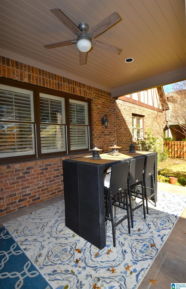 view of patio / terrace with an outdoor bar and ceiling fan