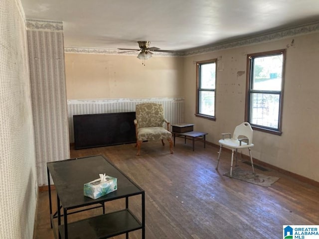 sitting room featuring hardwood / wood-style flooring and ceiling fan