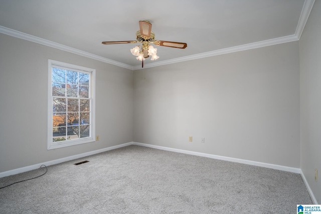 unfurnished room featuring ceiling fan, carpet, and ornamental molding