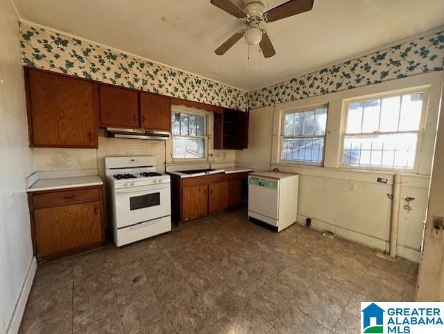 kitchen with ceiling fan and white gas stove