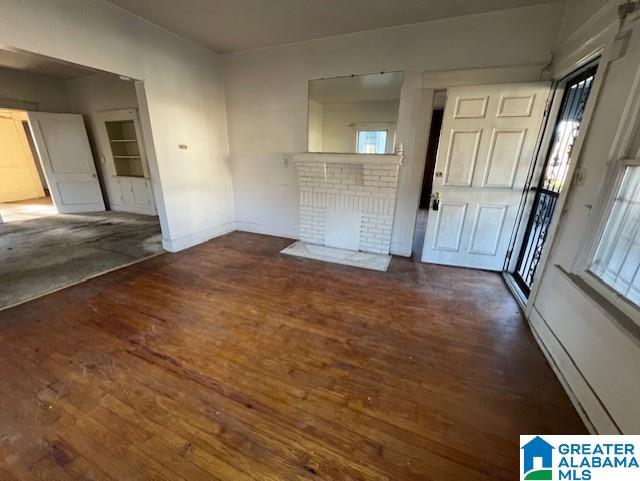 entryway with dark wood-type flooring and plenty of natural light