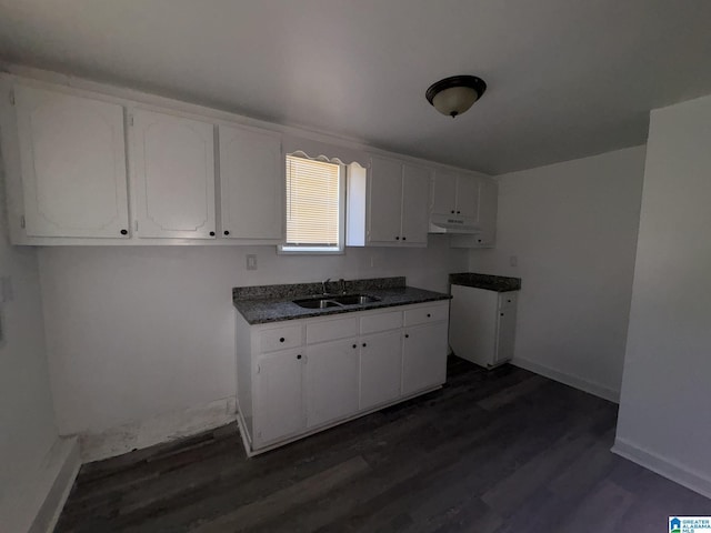 kitchen featuring sink, white cabinets, and dark wood-type flooring