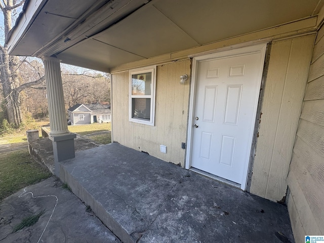 entrance to property featuring a patio area