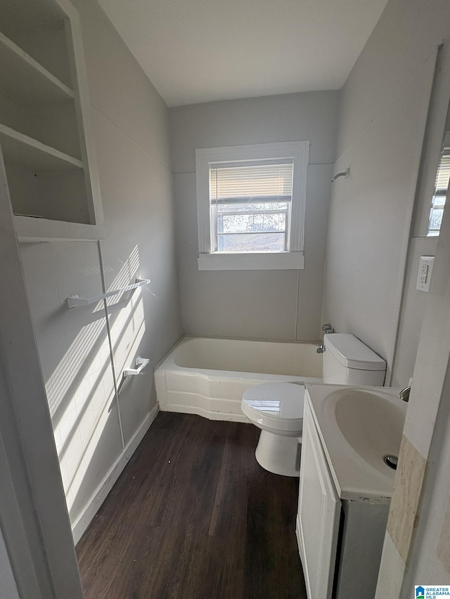 bathroom with hardwood / wood-style floors, vanity, and toilet