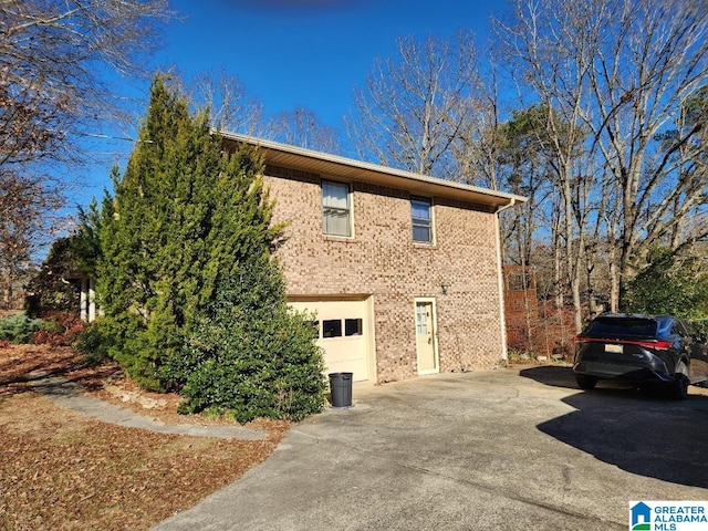 view of side of property with a garage