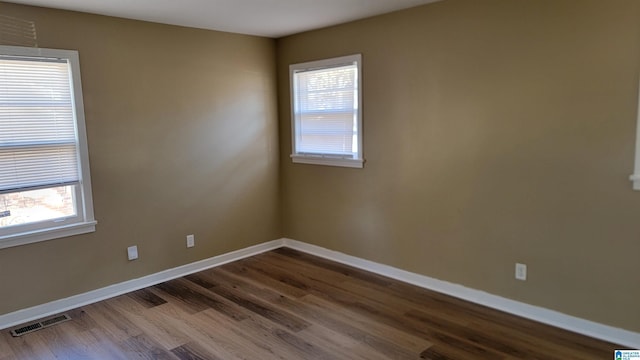 spare room with hardwood / wood-style flooring