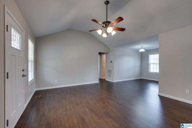 unfurnished living room featuring ceiling fan, dark hardwood / wood-style flooring, and lofted ceiling