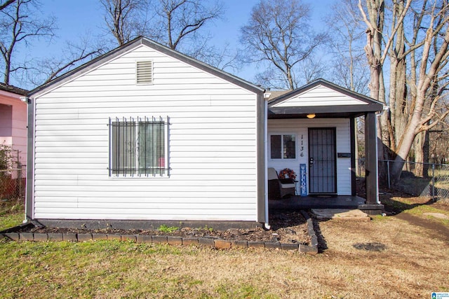 view of front of house featuring a front yard and a porch