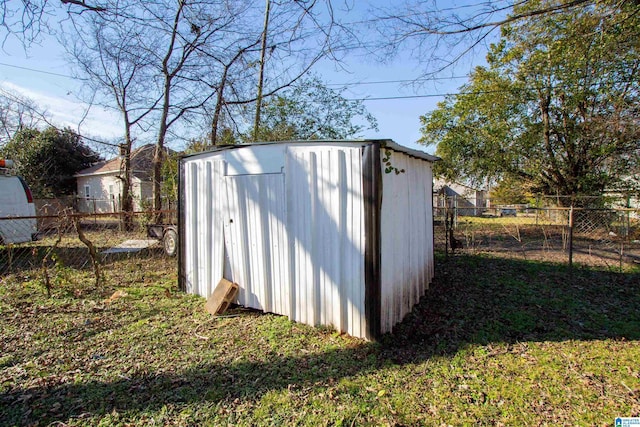 view of outdoor structure with a lawn